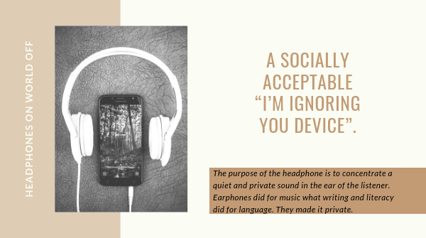 earphones plugged into a phone on a dark background.