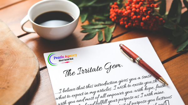 A cup of tee with a pen on a branded note book on a table with flowers beside them